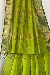 Glowing Green Tissue Stripes Saree with Zari Border